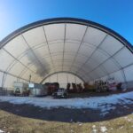 Image of a durable fabric hoop building with snow